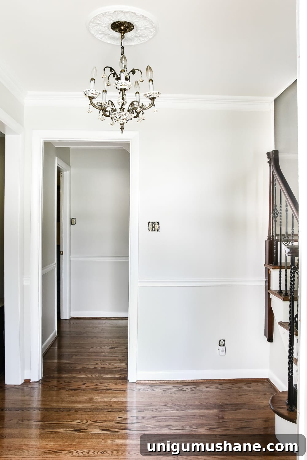 Neutral Paint Ideas to Update Your Foyer 7 Neutral Painted Foyer Update | Blesserhouse.com - A drab, dated foyer and staircase get a bright, neutral facelift with high contrast details using Benjamin Moore colors Classic Gray and Wrought Iron.