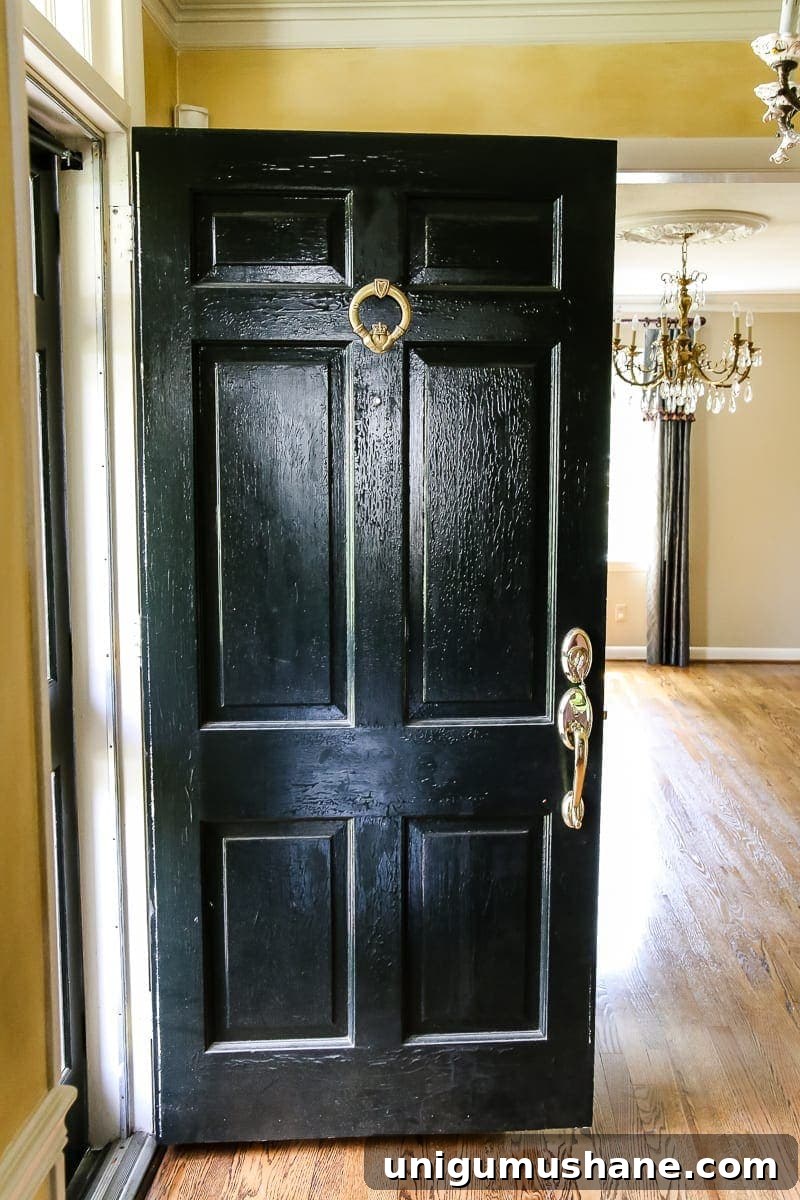 Neutral Paint Ideas to Update Your Foyer 9 Neutral Painted Foyer Update | Blesserhouse.com - A drab, dated foyer and staircase get a bright, neutral facelift with high contrast details using Benjamin Moore colors Classic Gray and Wrought Iron.