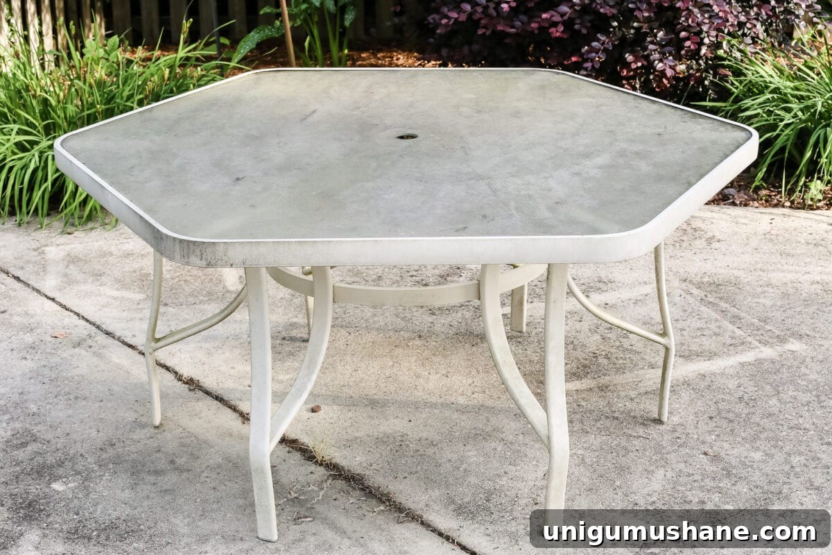 Deep Clean a Glass Patio Dining Table Without Streaks 3 How to Revive a Glass Patio Table | blesserhouse.com - A tutorial explaining how to clean, paint, and revive a glass patio table to make it look brand new in a few quick steps.