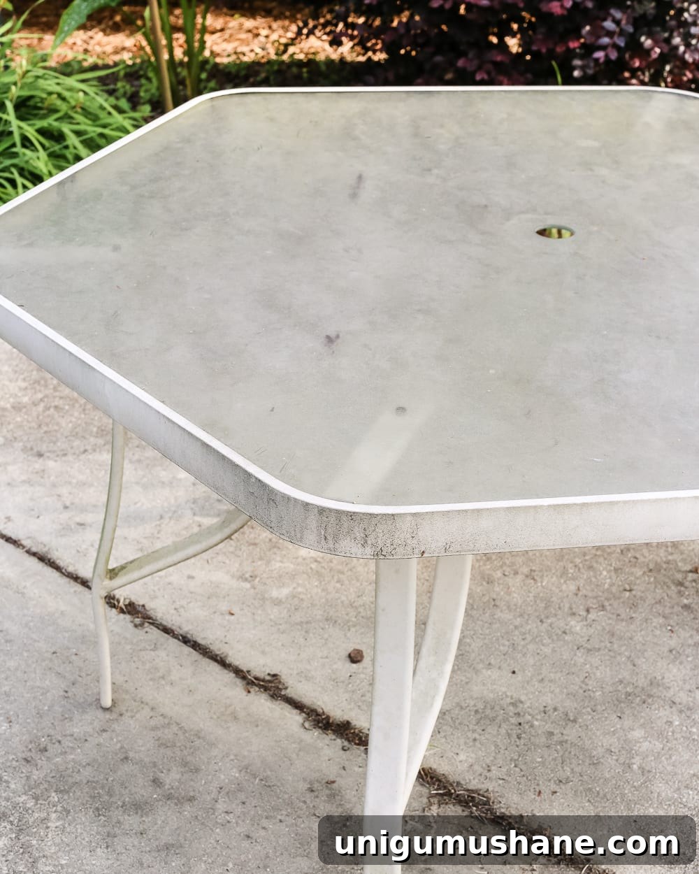 Deep Clean a Glass Patio Dining Table Without Streaks 4 How to Revive a Glass Patio Table | blesserhouse.com - A tutorial explaining how to clean, paint, and revive a glass patio table to make it look brand new in a few quick steps.