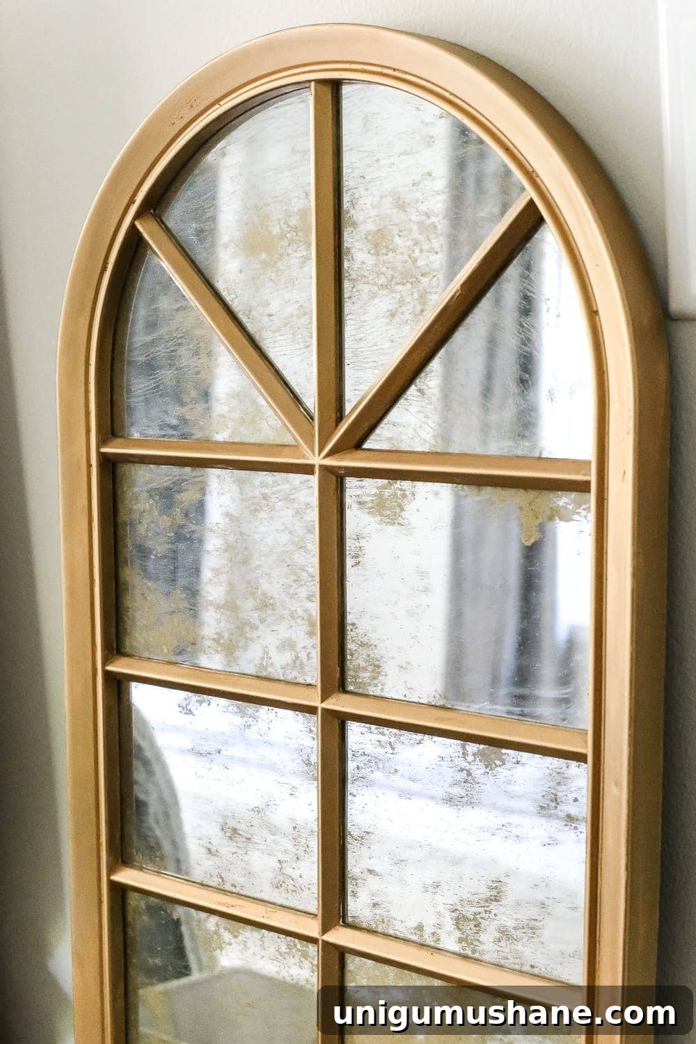 Create an Aged Gold Antique Mirror Finish 8 DIY Aged Gold Antique Mirror Makeover | blesserhouse.com - A DIY tutorial to transform a cheap, plastic mirror to look like an Anthropologie inspired aged gold antique mirror using Rub 'n Buff.
