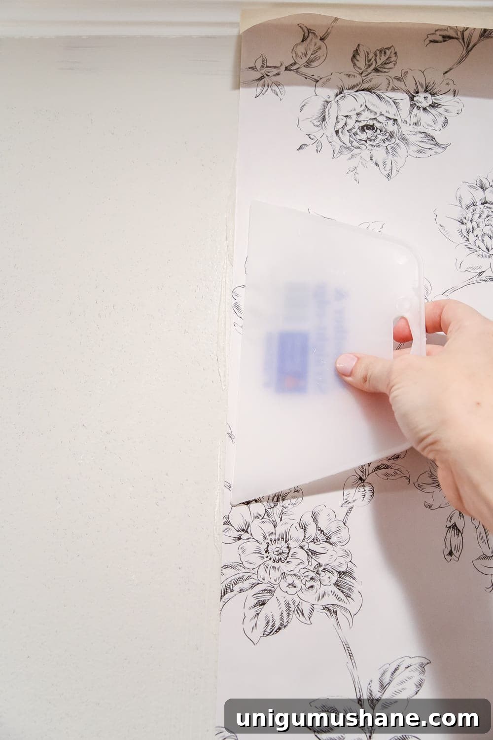 How to Hang Wallpaper: Step-by-Step for Perfect Results 4 Smoothing wallpaper with a brush