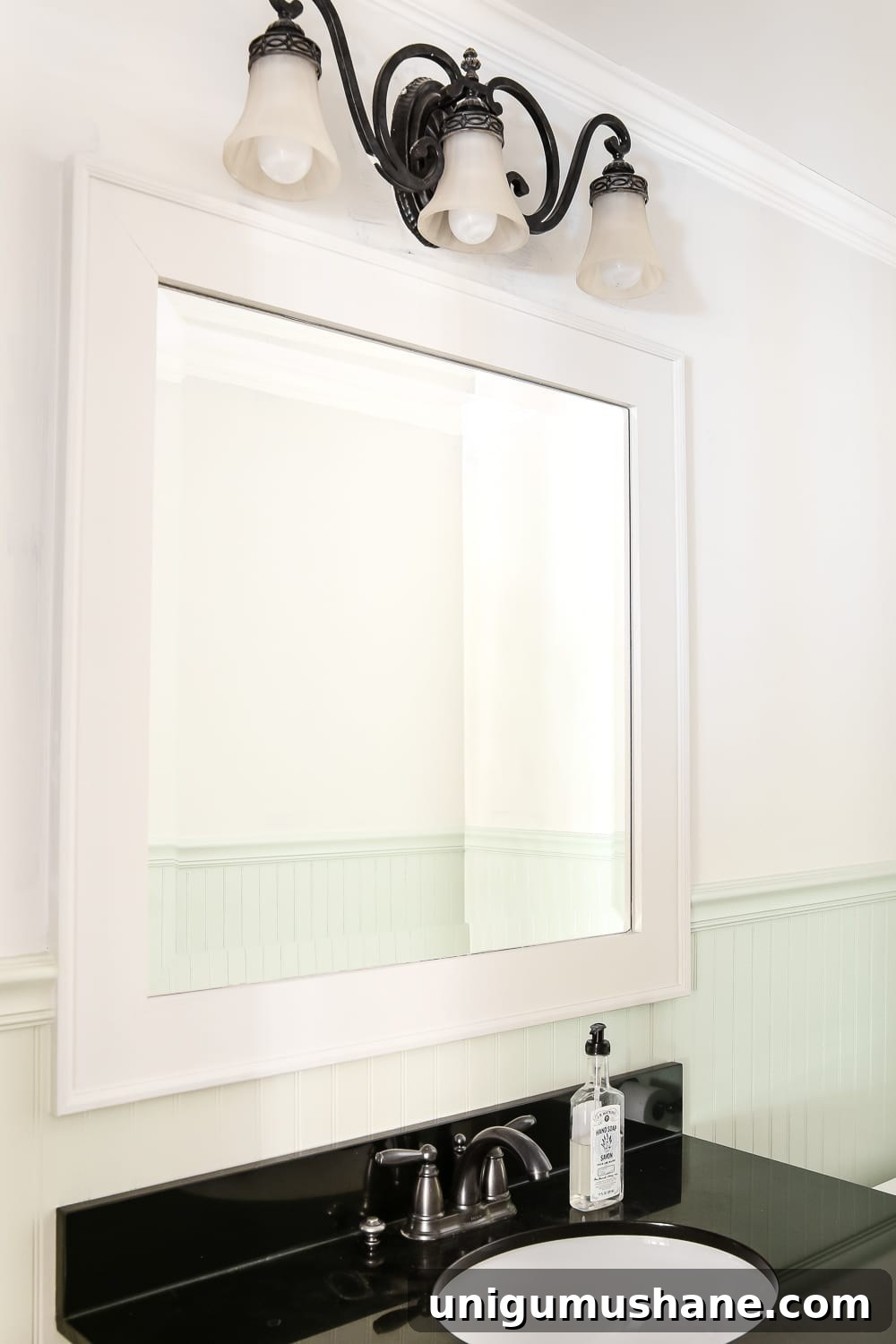 Dry Brushed Black Mirror: DIY Frame Makeover Guide 2 Dry Brushed Black Mirror Makeover | blesserhouse.com - A plain, white painted bathroom mirror gets a high-drama weathered makeover with black paint and dry brushing. (Tutorial)