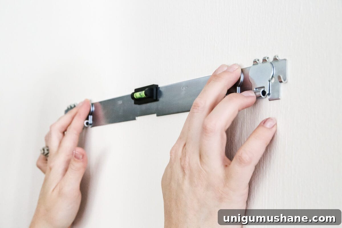 Securely Hang Heavy Wall Decor Without Studs 5 How to Hang Heavy Wall Decor Without Studs | blesserhouse.com - One handy little tool to use when hanging heavy wall decor on drywall that's not on a stud. (With little damage and an easy way to level!)