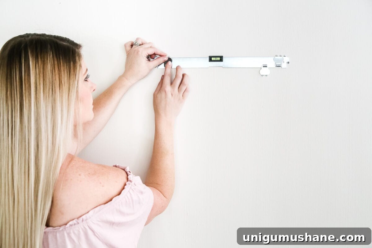 Securely Hang Heavy Wall Decor Without Studs 6 How to Hang Heavy Wall Decor Without Studs | blesserhouse.com - One handy little tool to use when hanging heavy wall decor on drywall that's not on a stud. (With little damage and an easy way to level!)