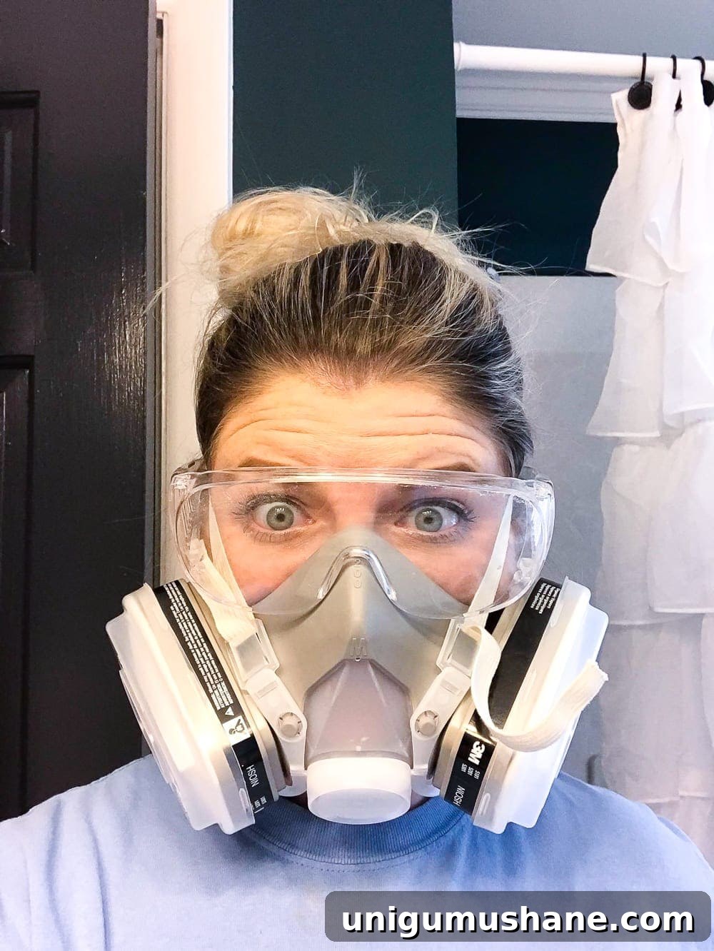 How to Paint a Bathroom Sink Countertop 13 wearing a respirator mask to paint a countertop