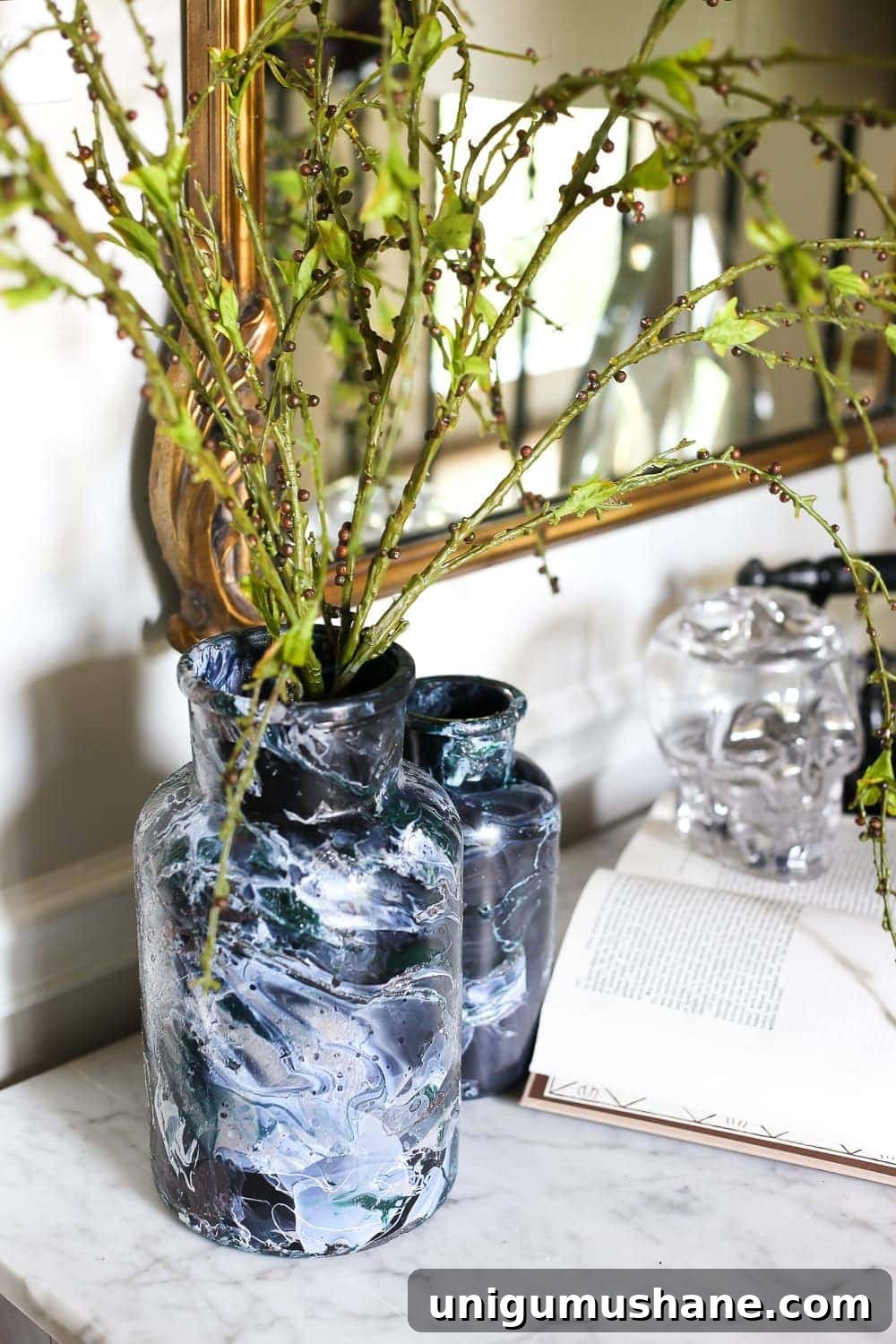 Create DIY Marbled Vases for Your Halloween Entryway 12 DIY Marbled Vases and Halloween Entryway | blesserhouse.com - A quick tutorial for how to turn old jars and bottles into marbled vases (using nail polish) on the cheap that are modern works of art.