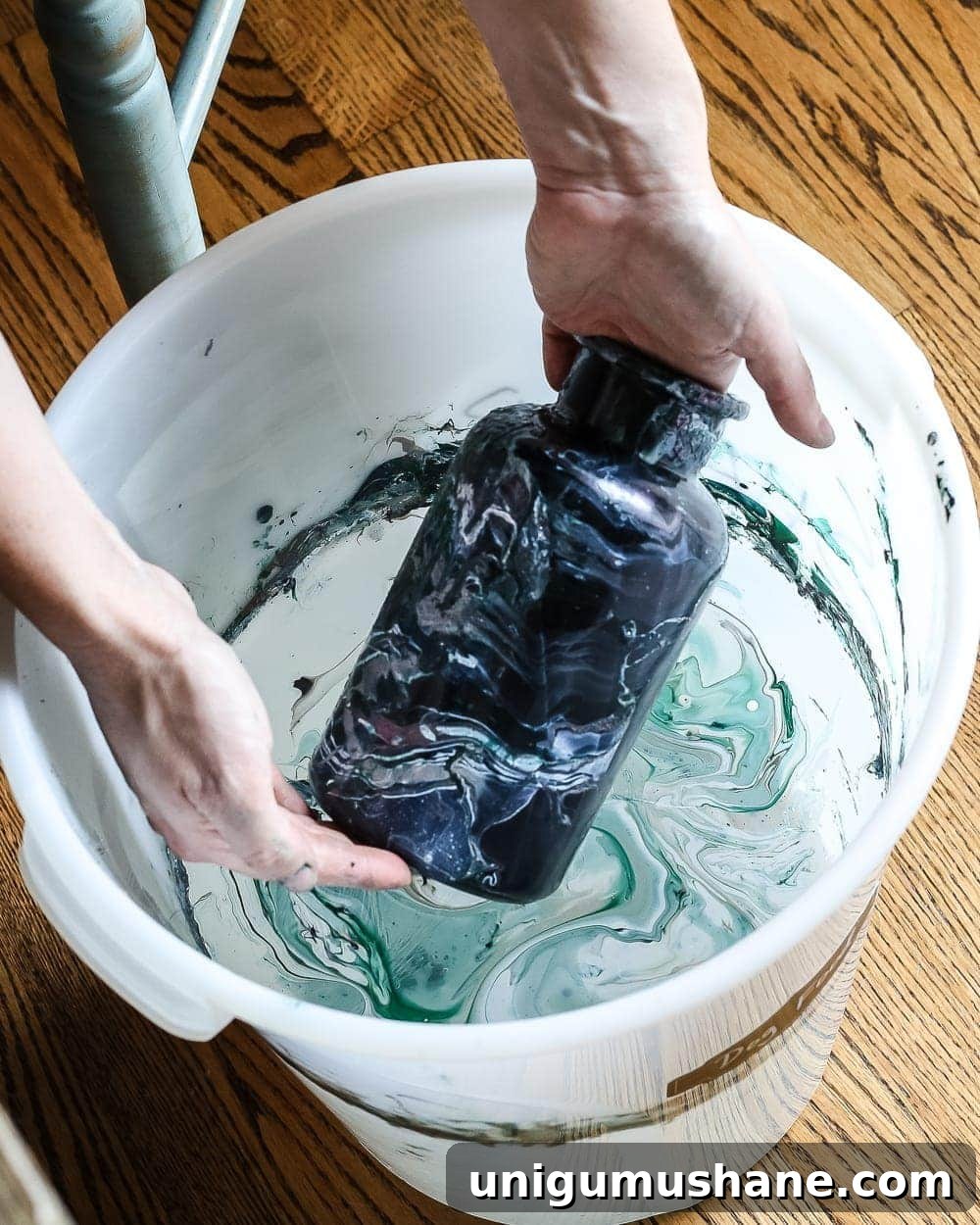 Create DIY Marbled Vases for Your Halloween Entryway 7 DIY Marbled Vases and Halloween Entryway | blesserhouse.com - A quick tutorial for how to turn old jars and bottles into marbled vases (using nail polish) on the cheap that are modern works of art.
