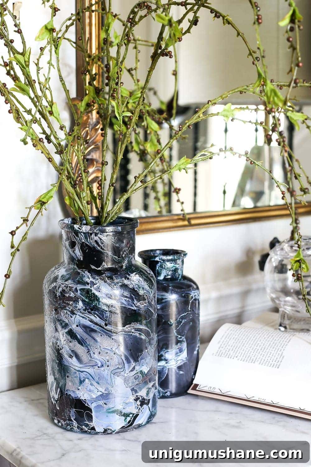 Create DIY Marbled Vases for Your Halloween Entryway 8 DIY Marbled Vases and Halloween Entryway | blesserhouse.com - A quick tutorial for how to turn old jars and bottles into marbled vases (using nail polish) on the cheap that are modern works of art.