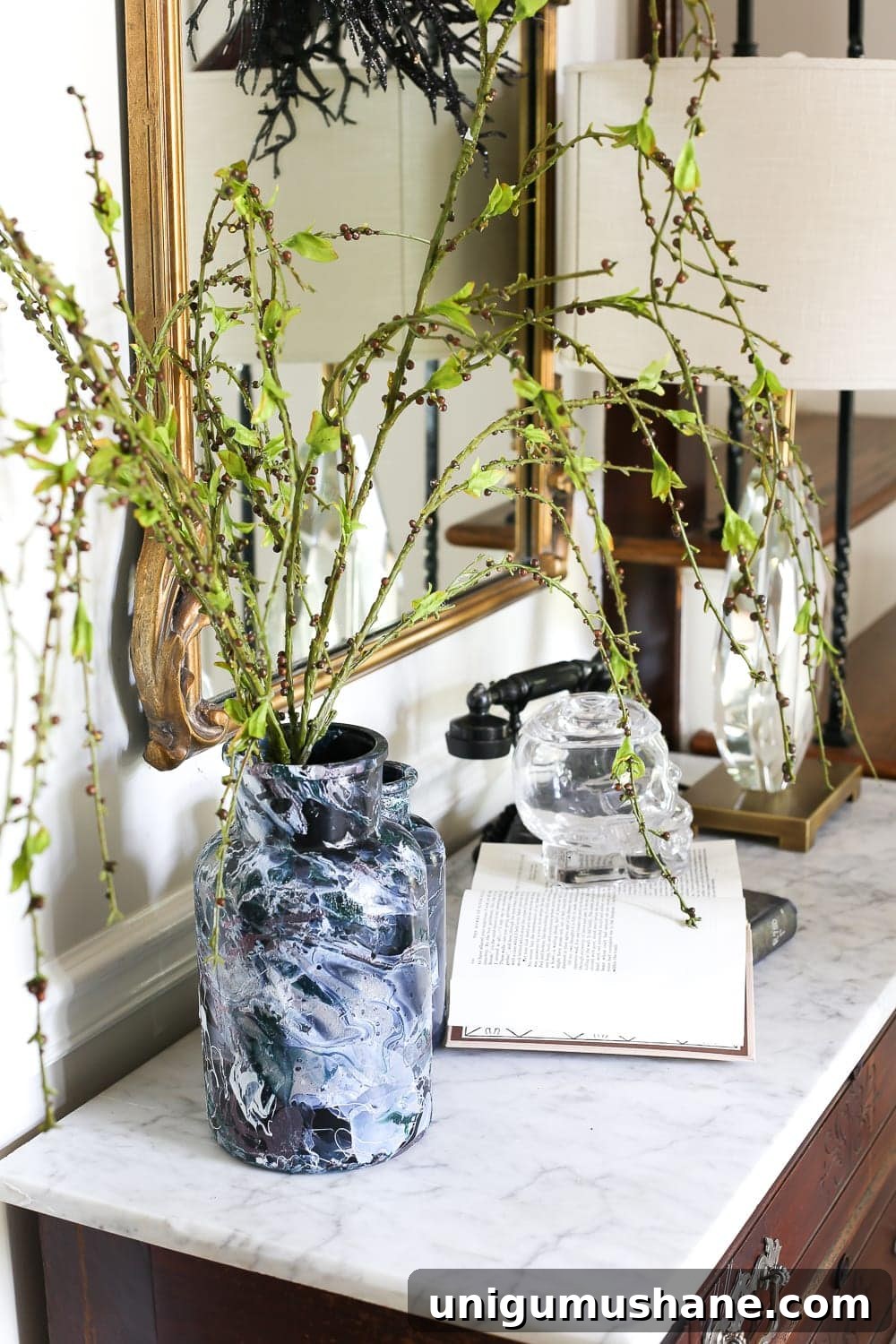 Create DIY Marbled Vases for Your Halloween Entryway 9 DIY Marbled Vases and Halloween Entryway | blesserhouse.com - A quick tutorial for how to turn old jars and bottles into marbled vases (using nail polish) on the cheap that are modern works of art.
