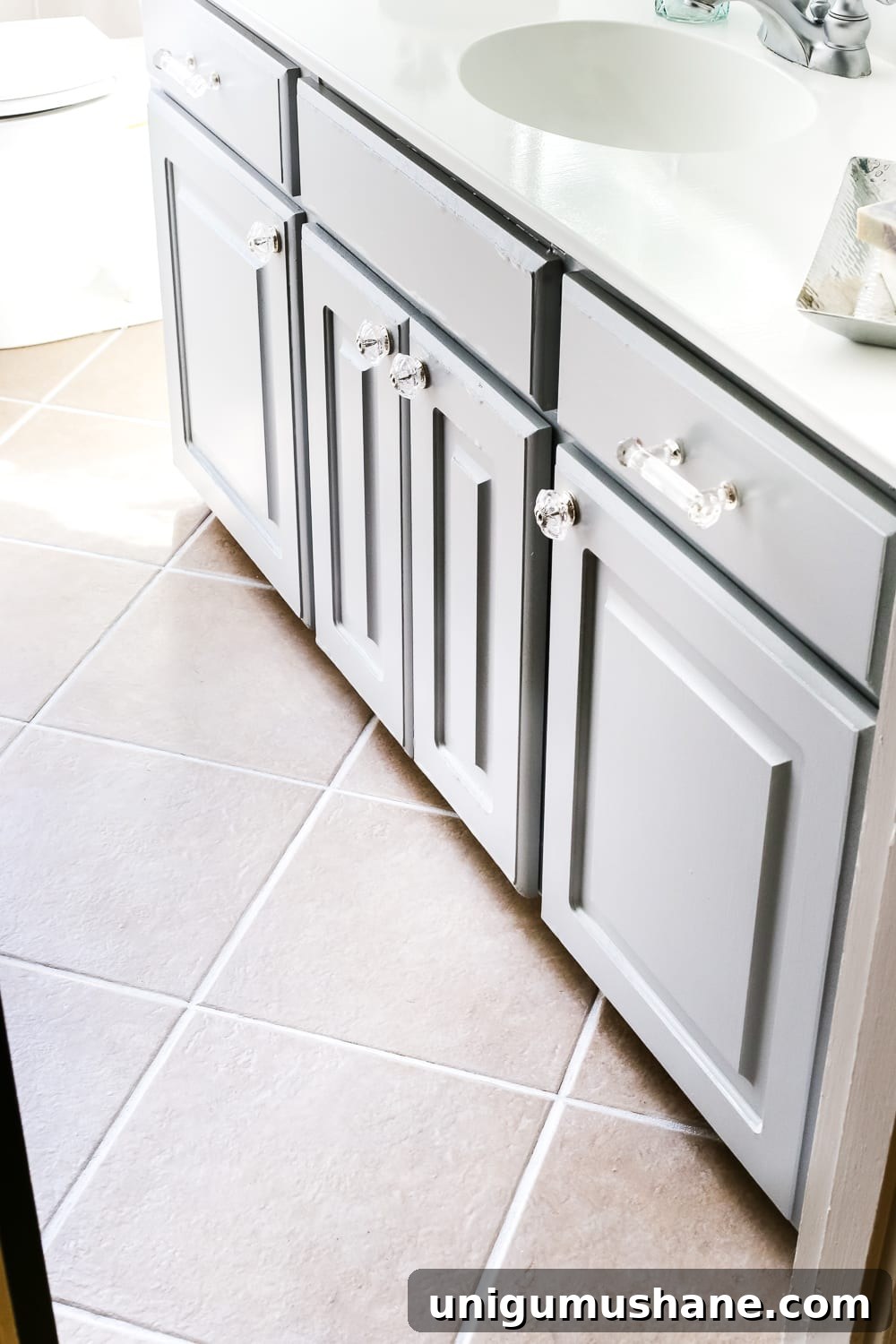 How to Refresh Tile Grout with Paint 9 Refreshed bathroom tile floor with clean painted grout lines