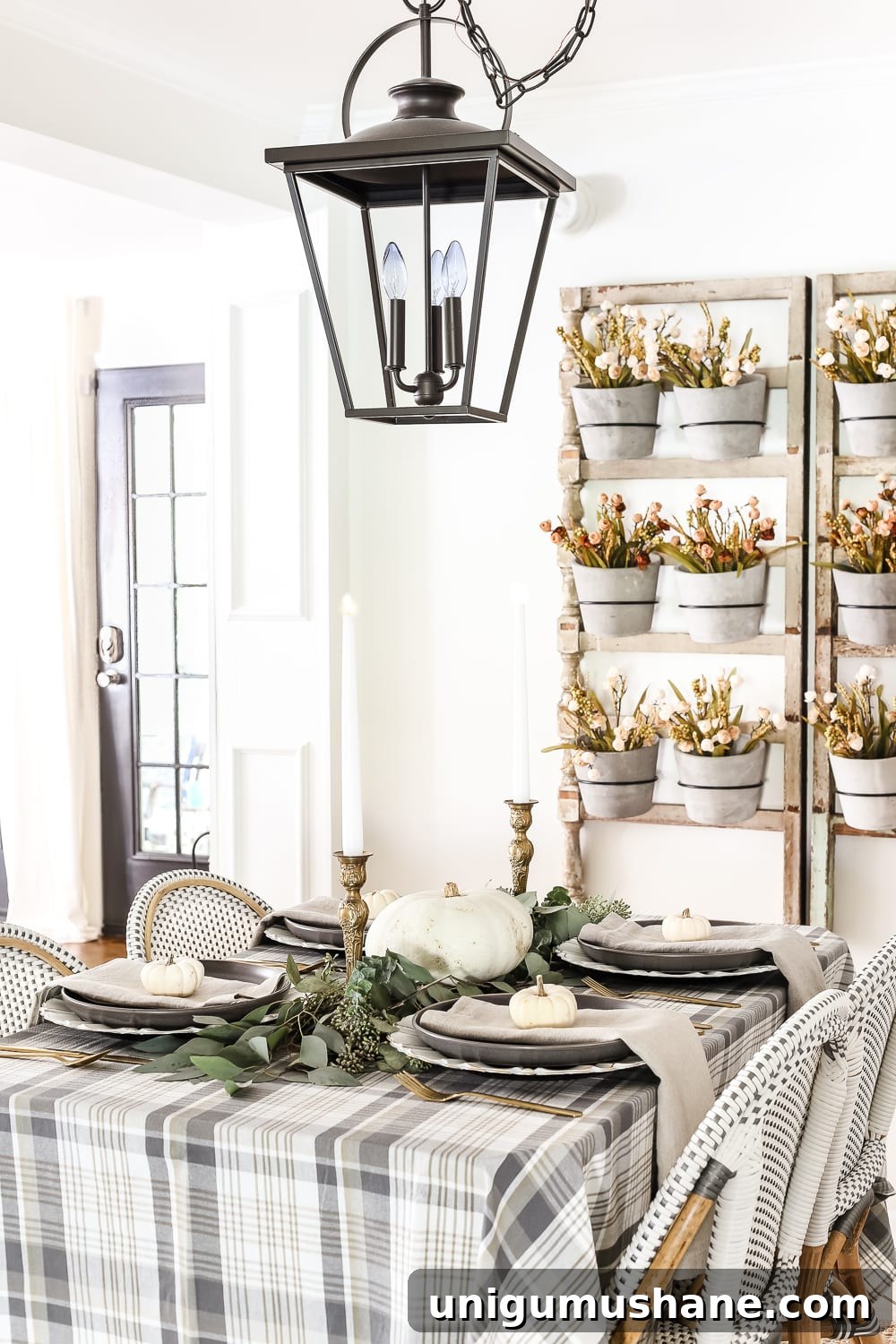 Neutral Thanksgiving Tablescape Ideas for an Understated Fall Table 2 Neutral Low-Key Thanksgiving Tablescape | blesserhouse.com - A neutral low-key Thanksgiving tablescape that is simple and inexpensive to recreate using plaid fabric, white pumpkins, eucalyptus, and brass.