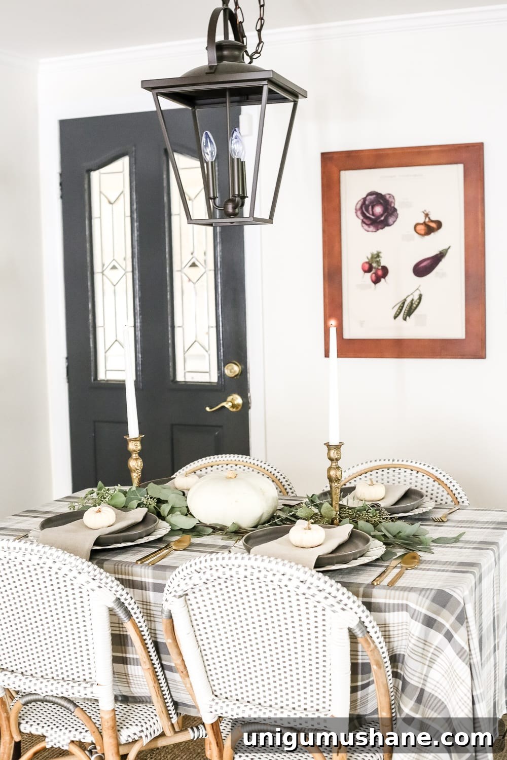 Neutral Thanksgiving Tablescape Ideas for an Understated Fall Table 8 Neutral Low-Key Thanksgiving Tablescape | blesserhouse.com - A neutral low-key Thanksgiving tablescape that is simple and inexpensive to recreate using plaid fabric, white pumpkins, eucalyptus, and brass.