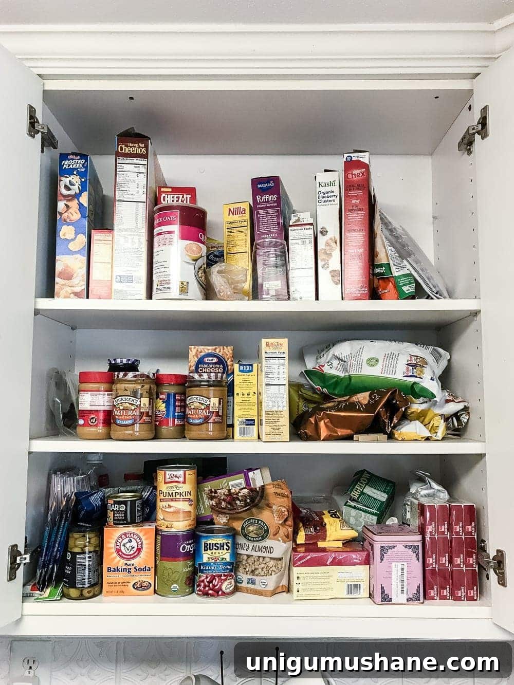 Organize Your Pantry Cabinet with Free Printable Labels 2 Pantry Cabinet Organization and Free Printable Label Set | blesserhouse.com - A cabinet gets a drastic organization makeover using inexpensive IKEA jars / baskets, hanging storage, and a free pantry label printable set. #organization