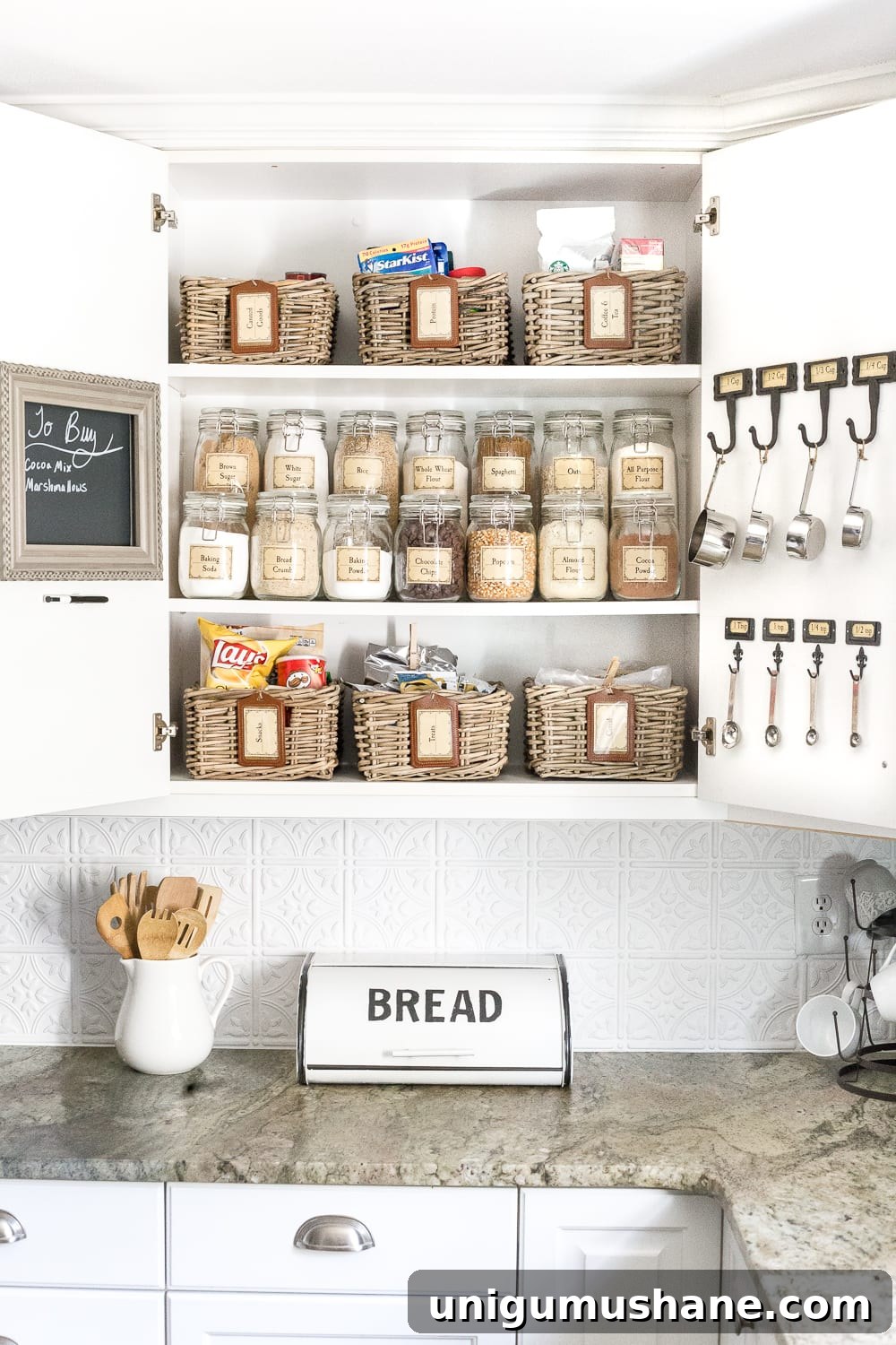 Organize Your Pantry Cabinet with Free Printable Labels 3 Pantry Cabinet Organization and Free Printable Label Set | blesserhouse.com - A cabinet gets a drastic organization makeover using inexpensive IKEA jars / baskets, hanging storage, and a free pantry label printable set. #organization