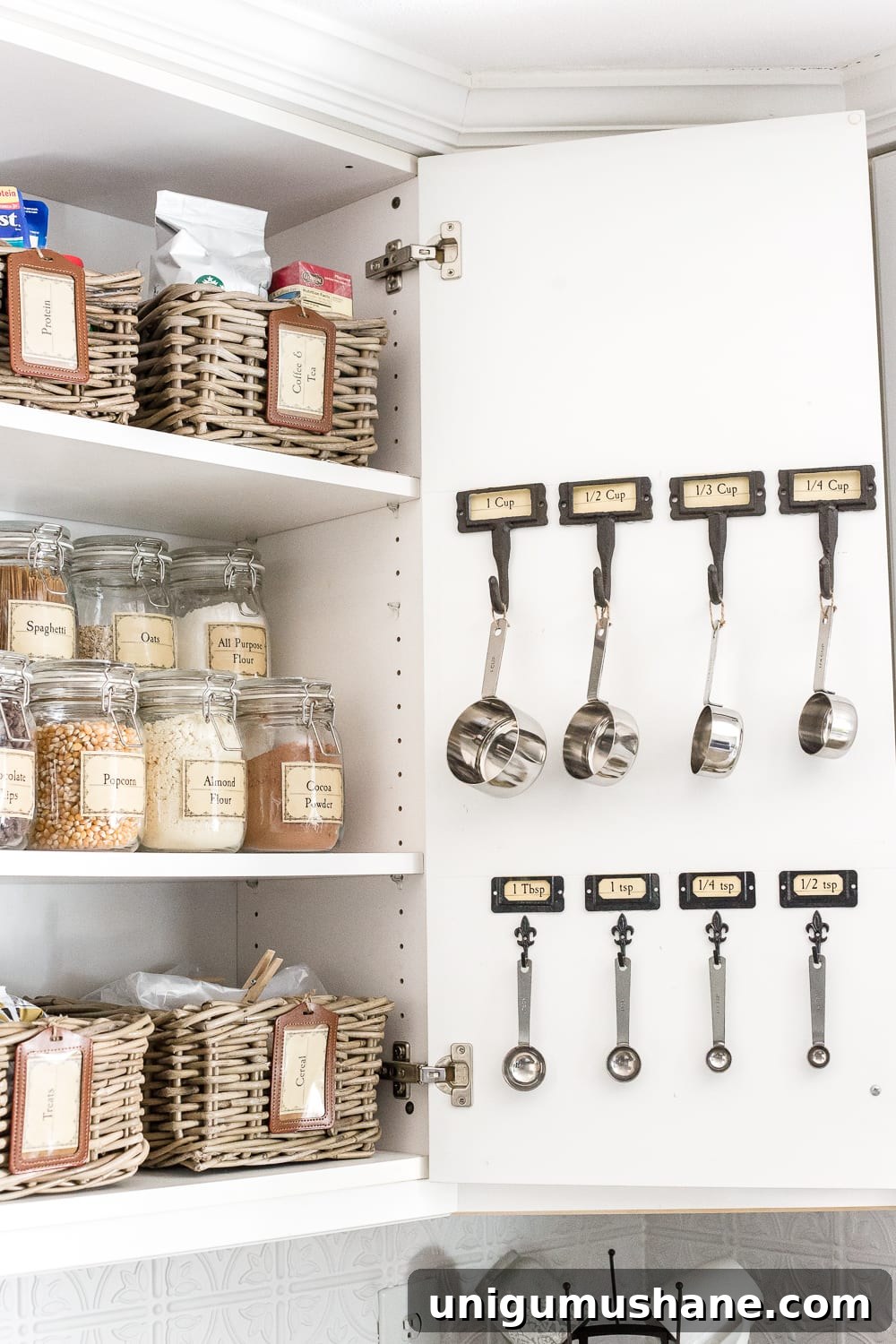 Organize Your Pantry Cabinet with Free Printable Labels 6 Pantry Cabinet Organization and Free Printable Label Set | blesserhouse.com - A cabinet gets a drastic organization makeover using inexpensive IKEA jars / baskets, hanging storage, and a free pantry label printable set. #organization