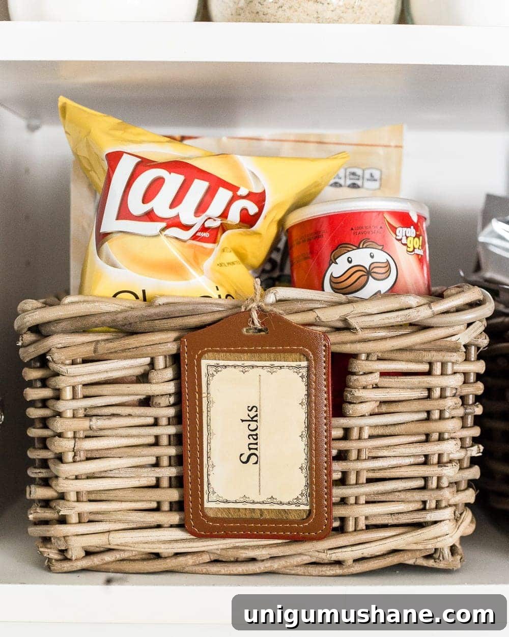 Organize Your Pantry Cabinet with Free Printable Labels 8 Pantry Cabinet Organization and Free Printable Label Set | blesserhouse.com - A cabinet gets a drastic organization makeover using inexpensive IKEA jars / baskets, hanging storage, and a free pantry label printable set. #organization