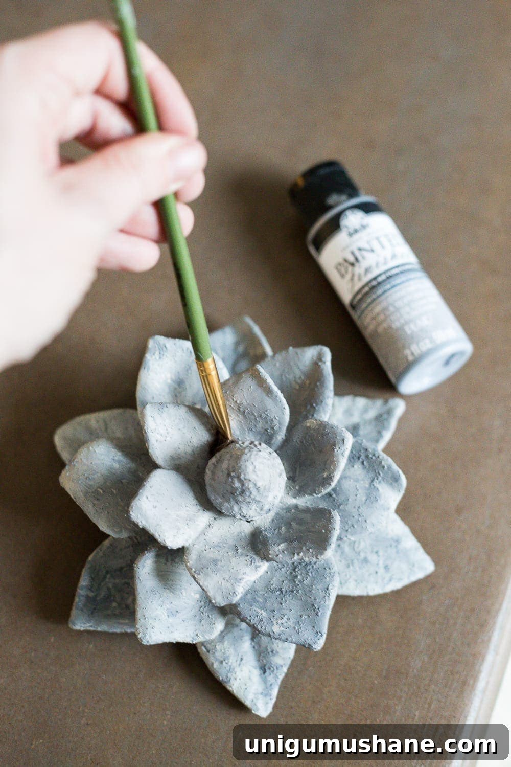 A quick and simple tutorial for how to make anything look like concrete with craft paint. #crafting #painting #thriftydecor 