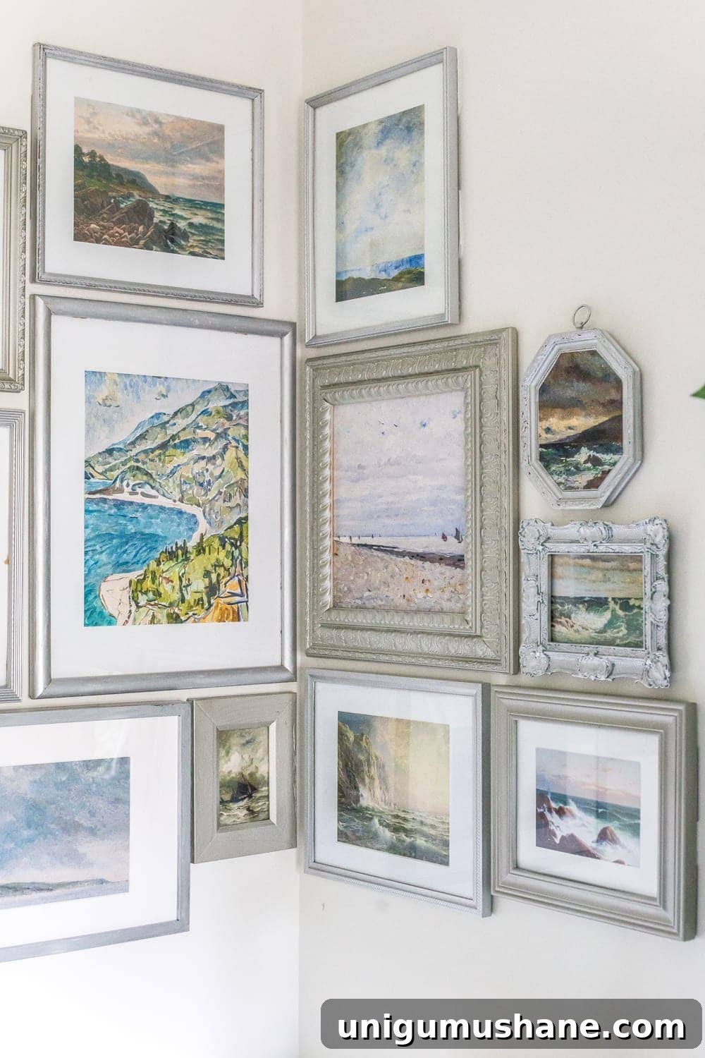 thrifted gallery wall with coastal art