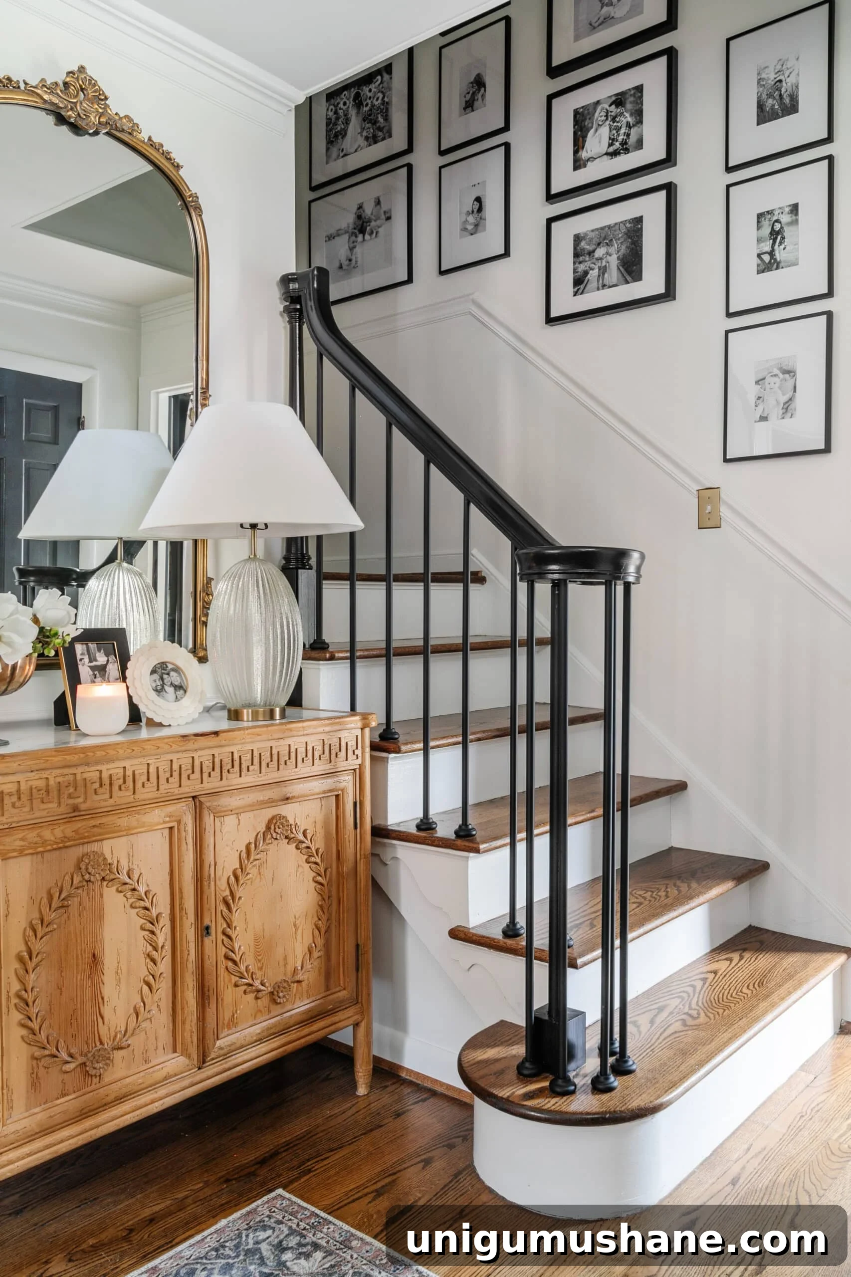 staircase gallery wall with black and white family photos