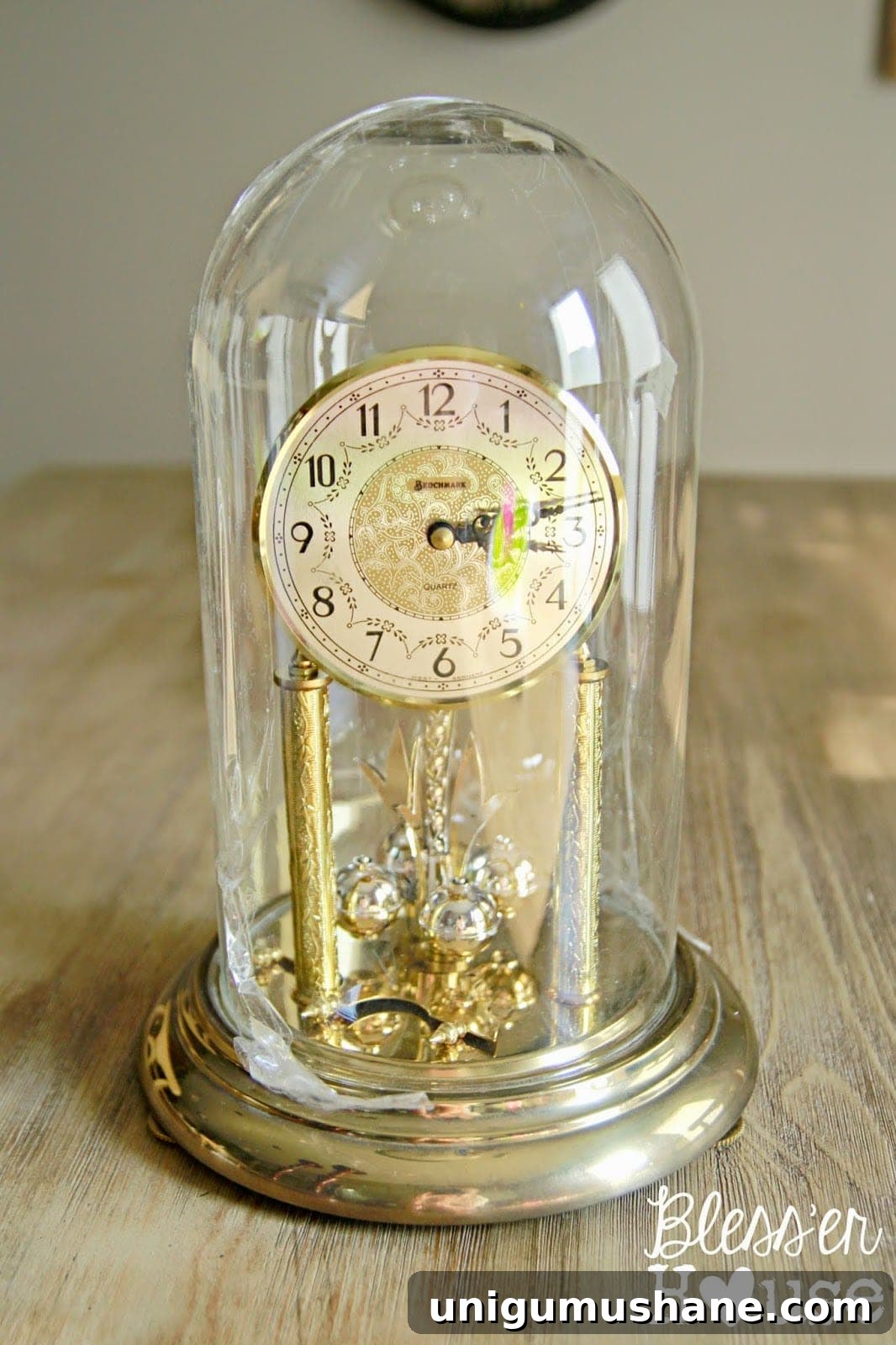 DIY Christmas Village Snow Globe Centerpiece 3 How to turn an old Christmas village figurine set and dome clocks into a snow globe inspired centerpiece. #Christmasdecor #ChristmasTable #ChristmasCenterpiece