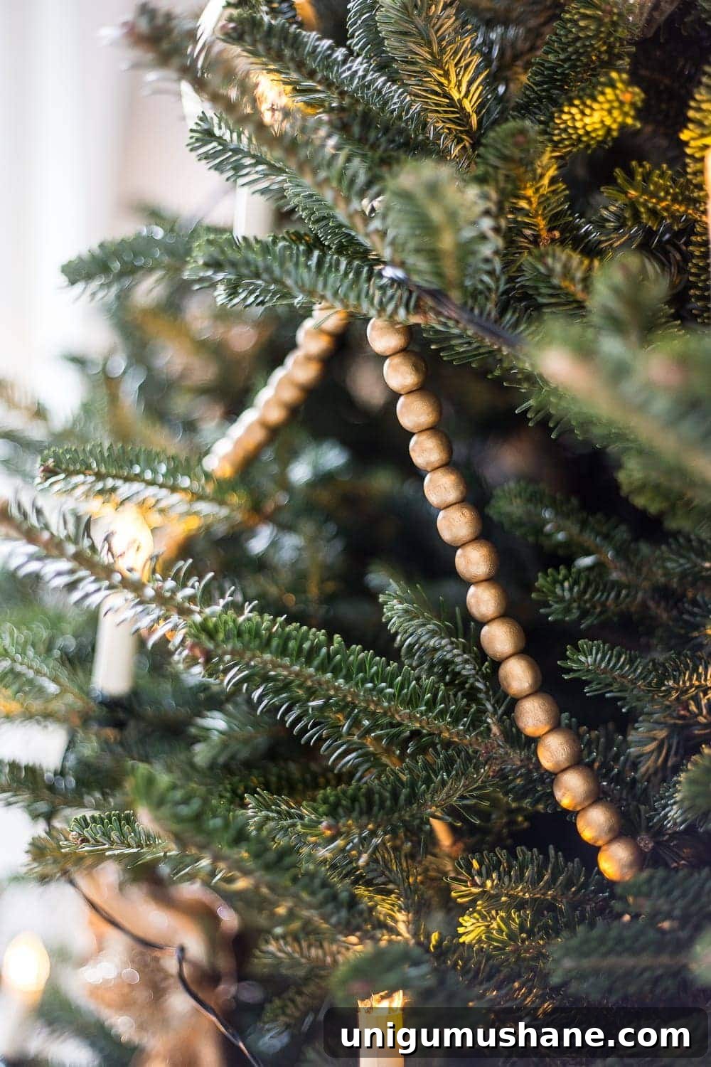 How to Decorate a Real Christmas Tree: Step-by-Step 8 wooden garland painted gold
