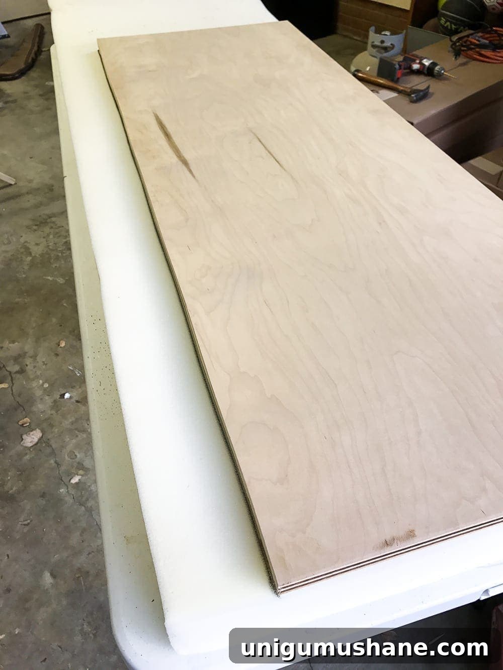 How to Turn a Coffee Table into an Ottoman Bench 8 Plywood cut for ottoman top