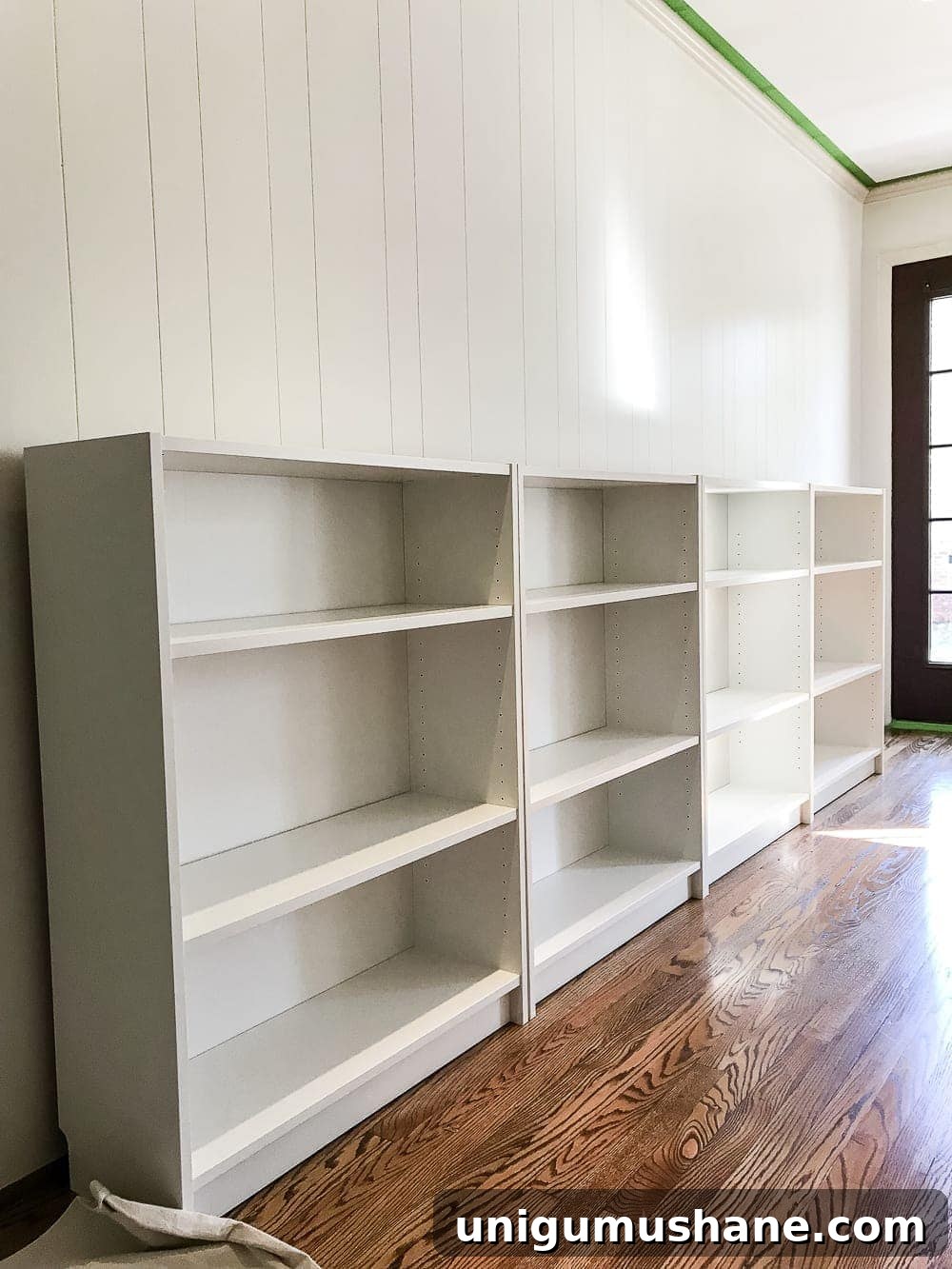 DIY Built-In Bookcases for Your Playroom 4 An easy to follow step-by-step tutorial showing how to build bookcase built-ins using IKEA Billy bookcases. #IKEAhack #homeimprovement #build #playroom