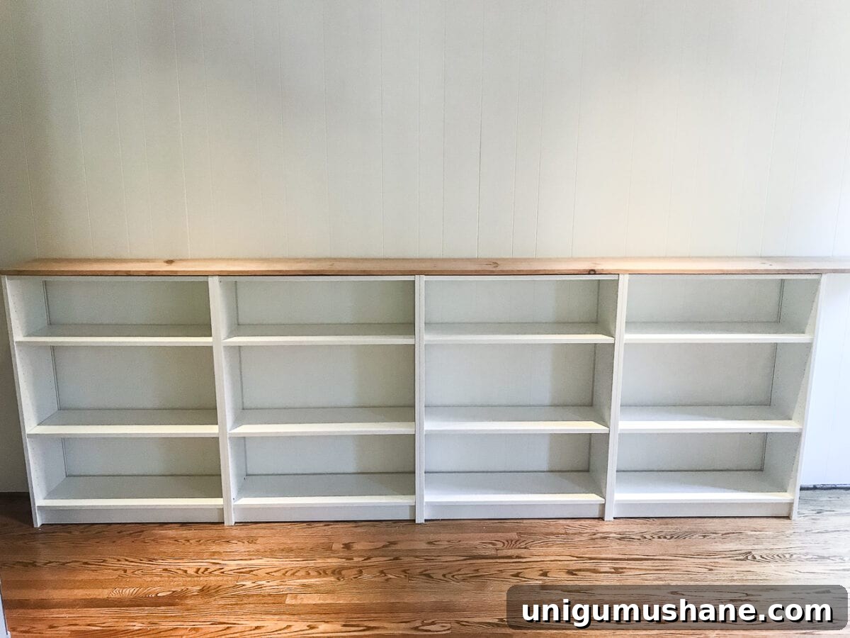 DIY Built-In Bookcases for Your Playroom 10 An easy to follow step-by-step tutorial showing how to build bookcase built-ins using IKEA Billy bookcases. #IKEAhack #homeimprovement #build #playroom