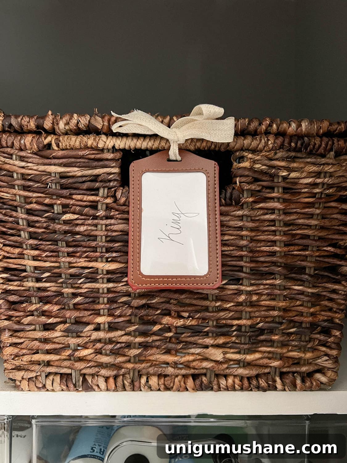 sheet set storage in basket with lanyard label