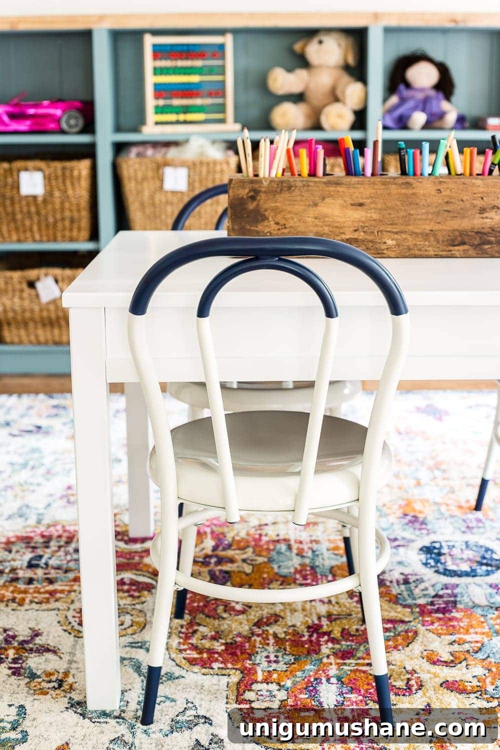 Refresh Your Playroom with Bright New Lighting and Furniture 6 A playroom makeover with bamboo light fixture, adjustable play table, and miniature French bistro chairs. #playroom #kidsdecor