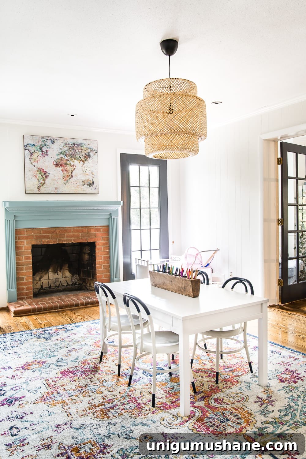 Refresh Your Playroom with Bright New Lighting and Furniture 10 A playroom makeover with bamboo light fixture, adjustable play table, and miniature French bistro chairs. #playroom #kidsdecor