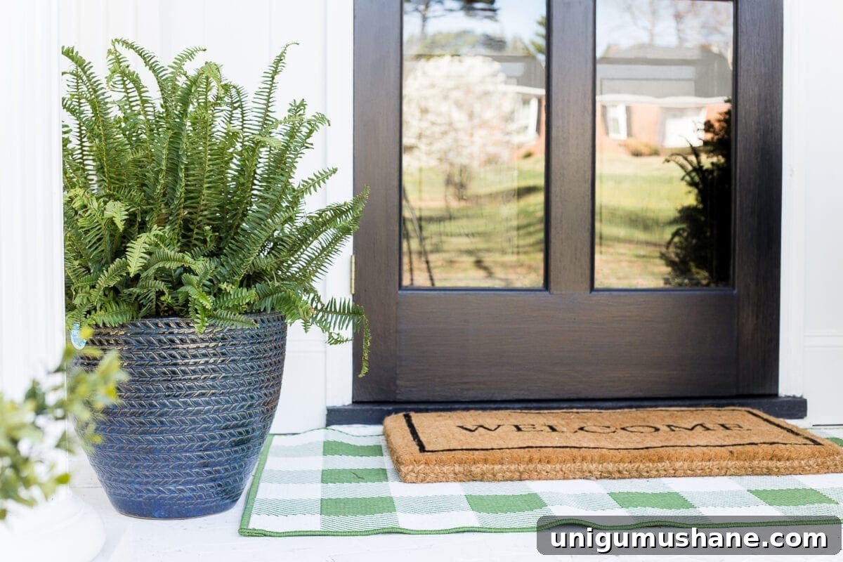 Small Porch Stoop Decor: 4 Stylish Ideas 6 4 easy steps to decorate a small porch stoop for spring to make any home more welcoming for guests. #springporch #smallporch #porchstoop