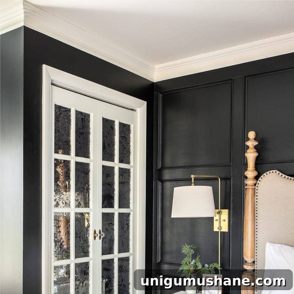Timeless Interior Design Trends for Your Home 9 black bedroom with white doors and crown