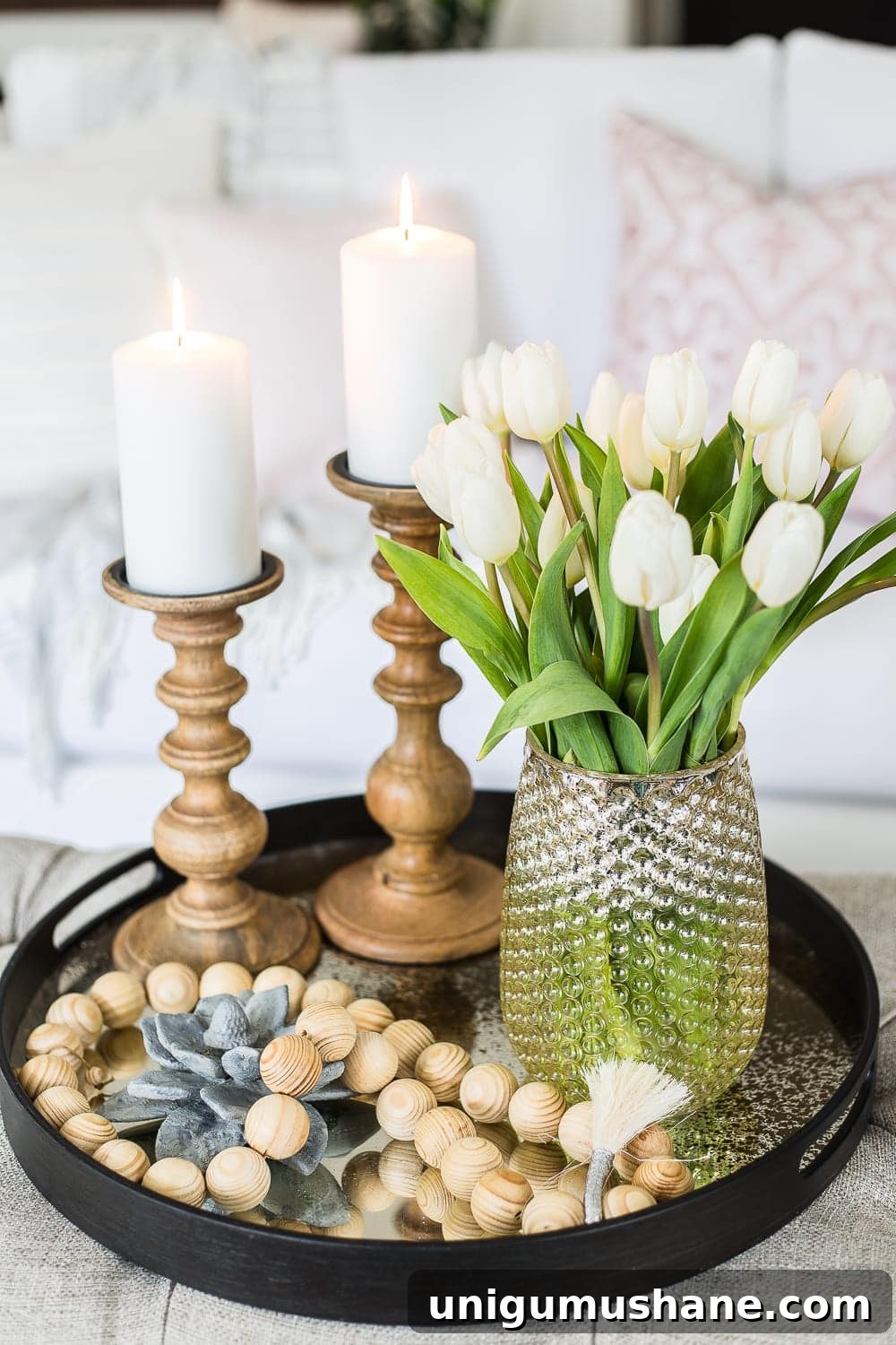 Spring Living Room Tour: Fresh Decor Ideas 6 A living room gets a spring refresh with simple florals, candle light, and light fabrics. #springdecor #livingroom #springlivingroom #springaccents #livingroomdesign #livingroomdecor #budgetdecor