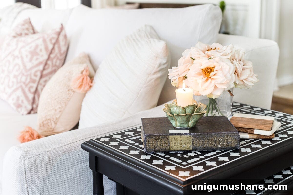 Spring Living Room Tour: Fresh Decor Ideas 7 A living room gets a spring refresh with simple florals, candle light, and light fabrics. #springdecor #livingroom #springlivingroom #springaccents #livingroomdesign #livingroomdecor #budgetdecor