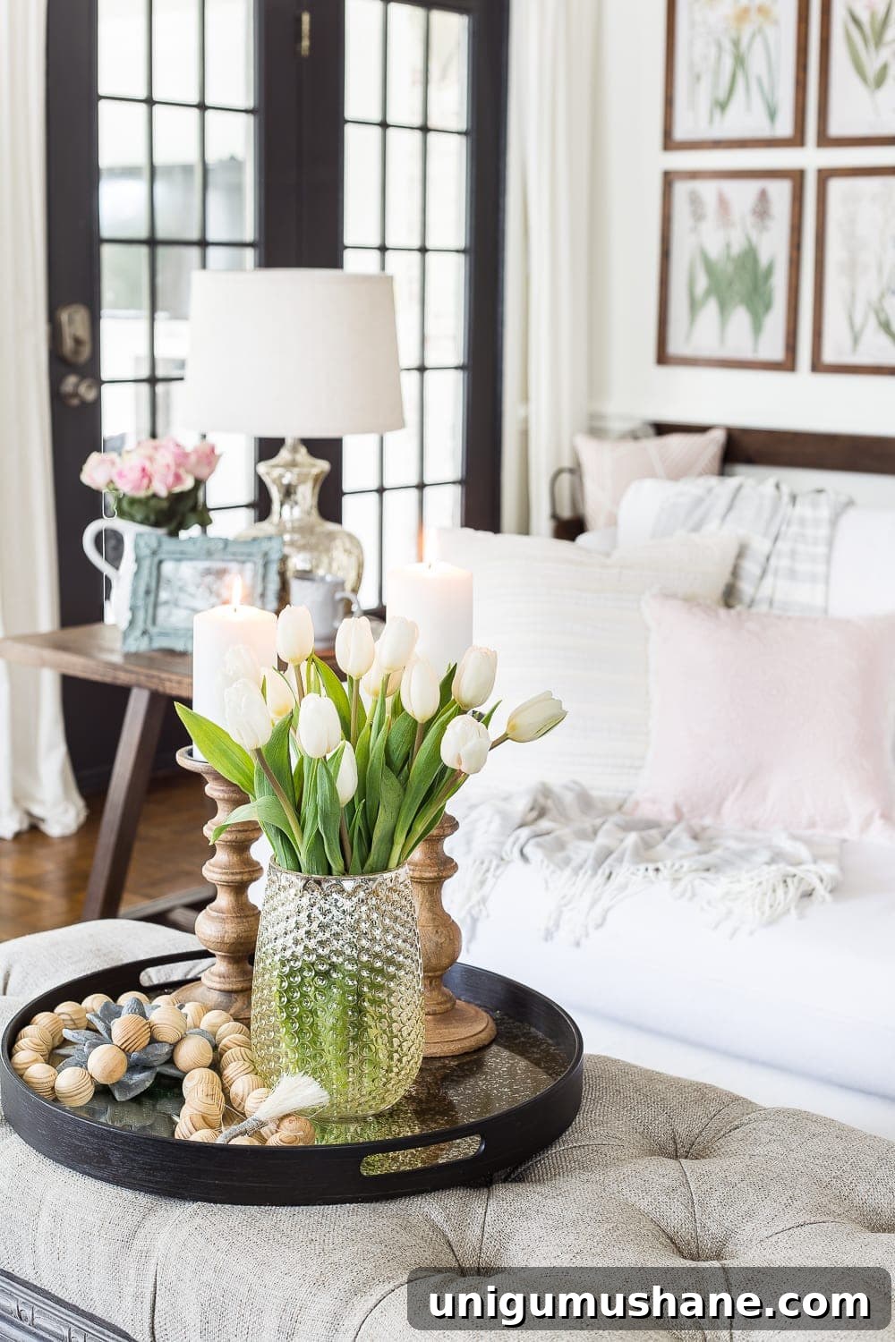Spring Living Room Tour: Fresh Decor Ideas 9 A living room gets a spring refresh with simple florals, candle light, and light fabrics. #springdecor #livingroom #springlivingroom #springaccents #livingroomdesign #livingroomdecor #budgetdecor