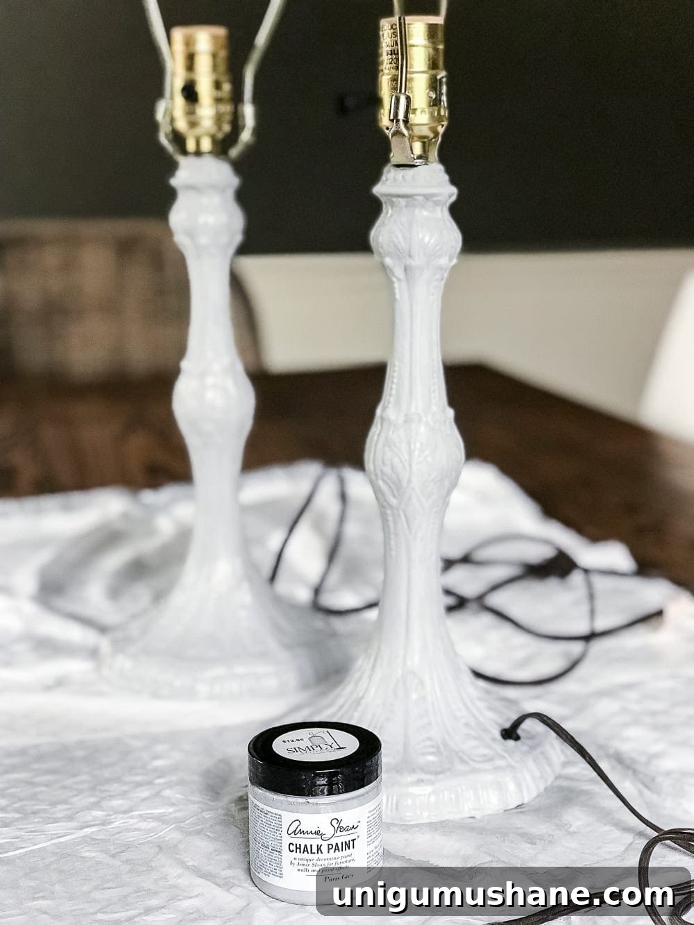 A thrifted table lamp gets a French Baroque designer inspired makeover using Annie Sloan Chalk Paint in Paris Grey, Pure White, clear wax, and dark wax.