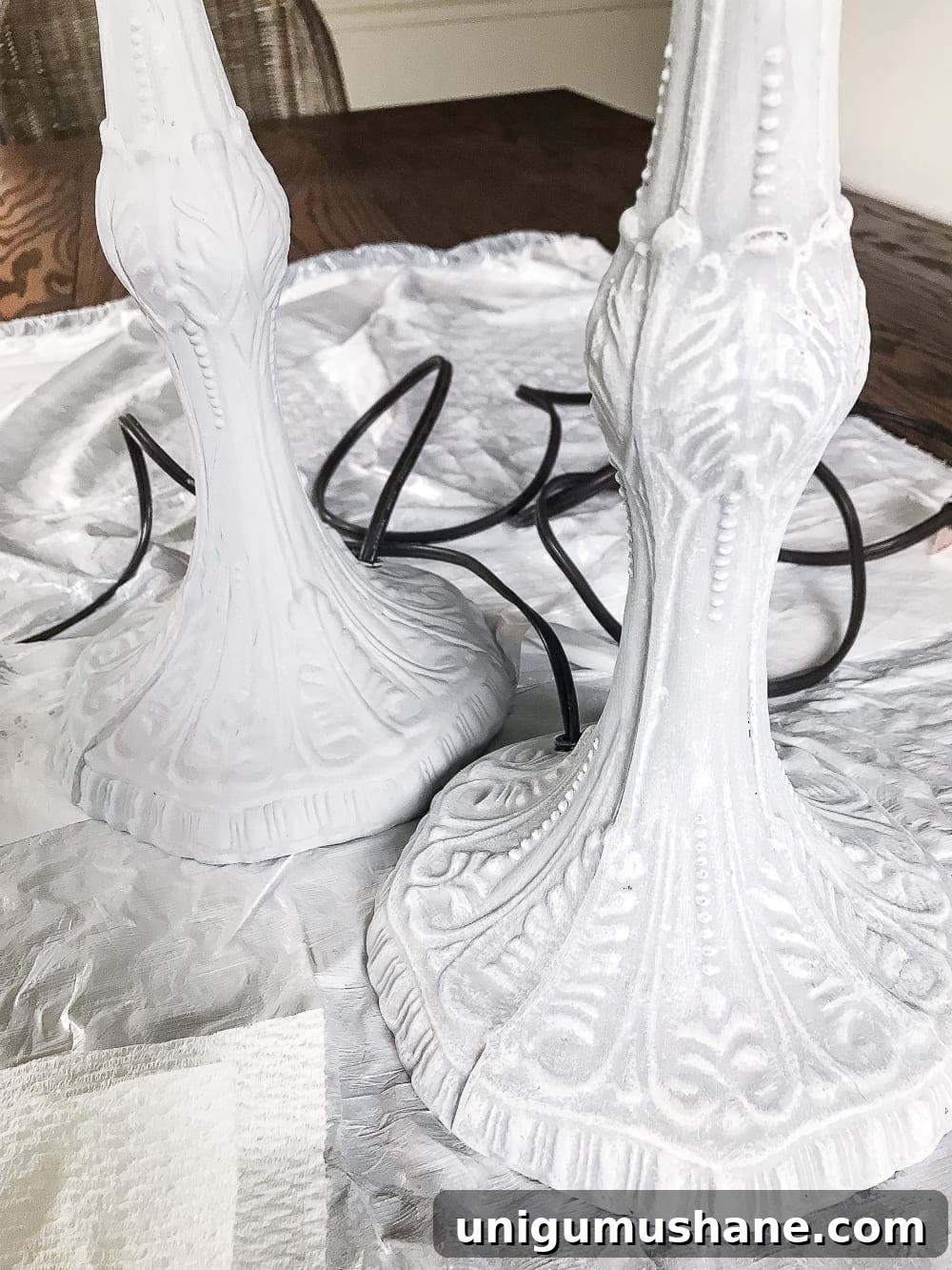 A thrifted table lamp gets a French Baroque designer inspired makeover using Annie Sloan Chalk Paint in Paris Grey, Pure White, clear wax, and dark wax.