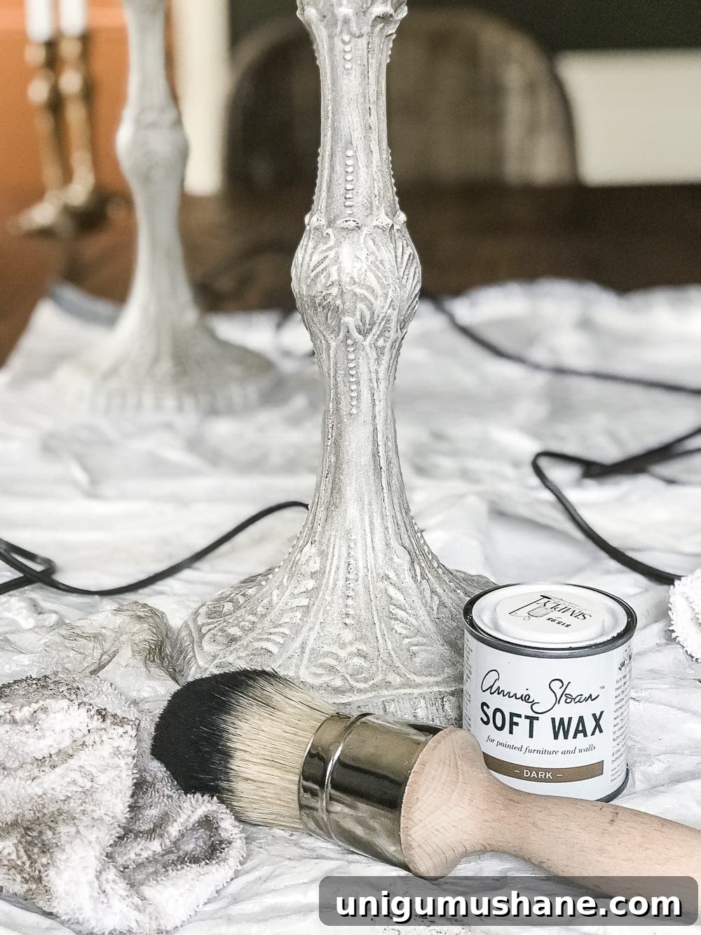 A thrifted table lamp gets a French Baroque designer inspired makeover using Annie Sloan Chalk Paint in Paris Grey, Pure White, clear wax, and dark wax.