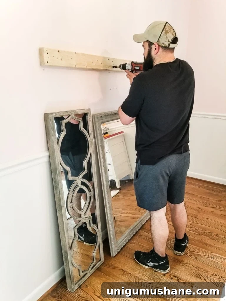 How to make a ballet barre with mirrors and shelf brackets and how to hang wall decor on a chair rail, board and batten, or molding #balletbarre #kidsdecor #girldecor #girlbedroom #girlroom #kidsroom #walldecor #hanginghack #wallhack #diywalldecor 