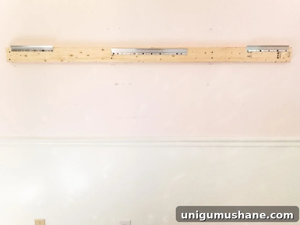 How to make a ballet barre with mirrors and shelf brackets and how to hang wall decor on a chair rail, board and batten, or molding #balletbarre #kidsdecor #girldecor #girlbedroom #girlroom #kidsroom #walldecor #hanginghack #wallhack #diywalldecor 