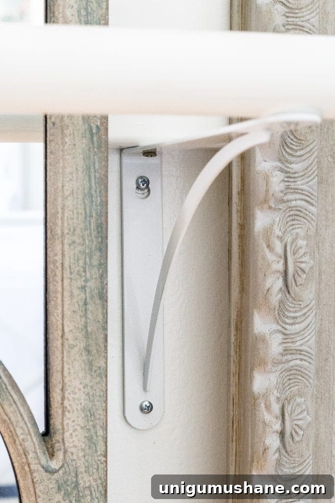 How to make a ballet barre with mirrors and shelf brackets and how to hang wall decor on a chair rail, board and batten, or molding #balletbarre #kidsdecor #girldecor #girlbedroom #girlroom #kidsroom #walldecor #hanginghack #wallhack #diywalldecor 