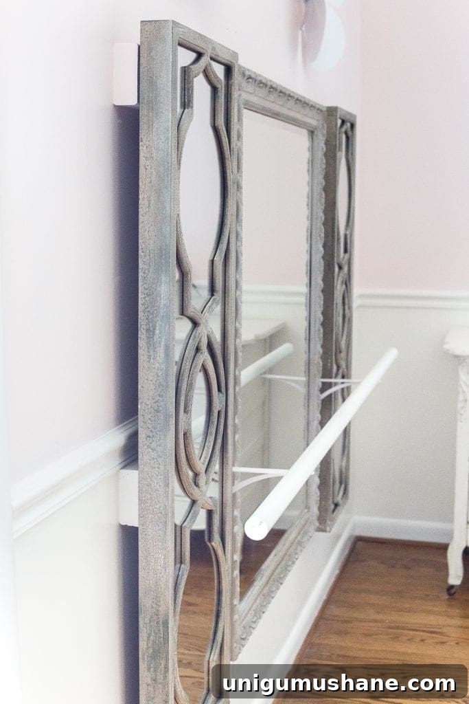 How to make a ballet barre with mirrors and shelf brackets and how to hang wall decor on a chair rail, board and batten, or molding #balletbarre #kidsdecor #girldecor #girlbedroom #girlroom #kidsroom #walldecor #hanginghack #wallhack #diywalldecor 