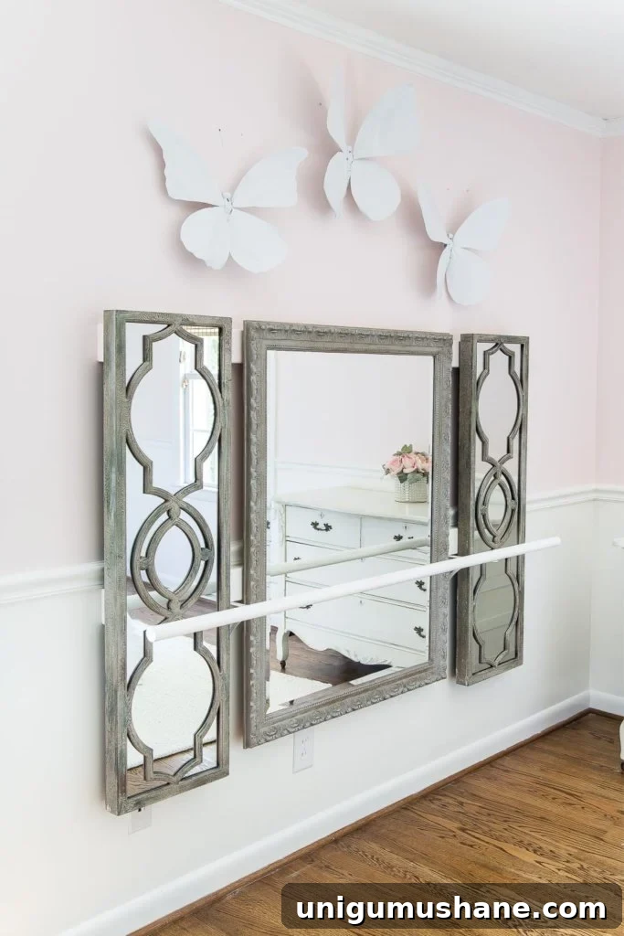 How to make a ballet barre with mirrors and shelf brackets and how to hang wall decor on a chair rail, board and batten, or molding #balletbarre #kidsdecor #girldecor #girlbedroom #girlroom #kidsroom #walldecor #hanginghack #wallhack #diywalldecor 