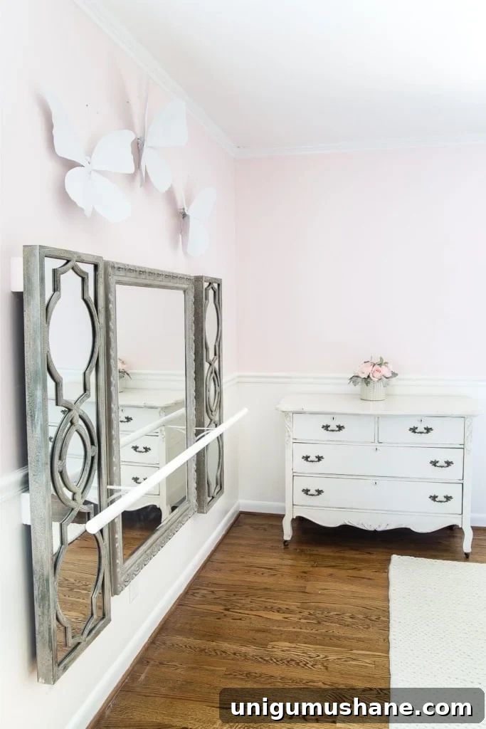 How to make a ballet barre with mirrors and shelf brackets and how to hang wall decor on a chair rail, board and batten, or molding #balletbarre #kidsdecor #girldecor #girlbedroom #girlroom #kidsroom #walldecor #hanginghack #wallhack #diywalldecor 