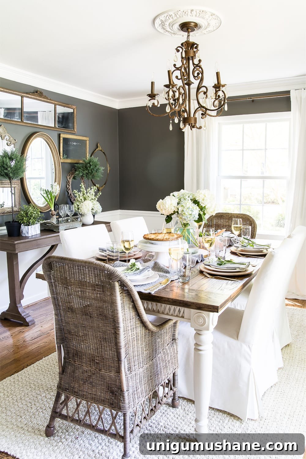 A painted dining table with an oak tabletop and neutral dining room decor.