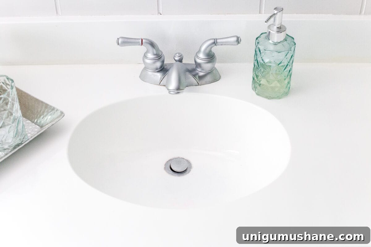 Painted Sink, Countertop, Tub and Shower: 8-Month Update 9 How to paint a sink, countertop, tub, and shower for $100 and how to make it last using Rustoleum Tub & Tile Refinishing Kit #bathroom #bathroommakeover #diyproject #homeimprovement #paintedsink #paintedcountertop #paintedtub #paintedshower