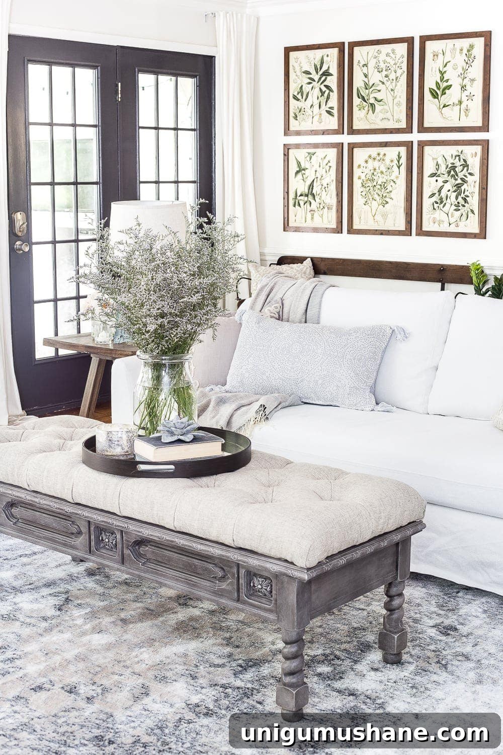 summer living room featuring summer botanical prints and blue/gray accents
