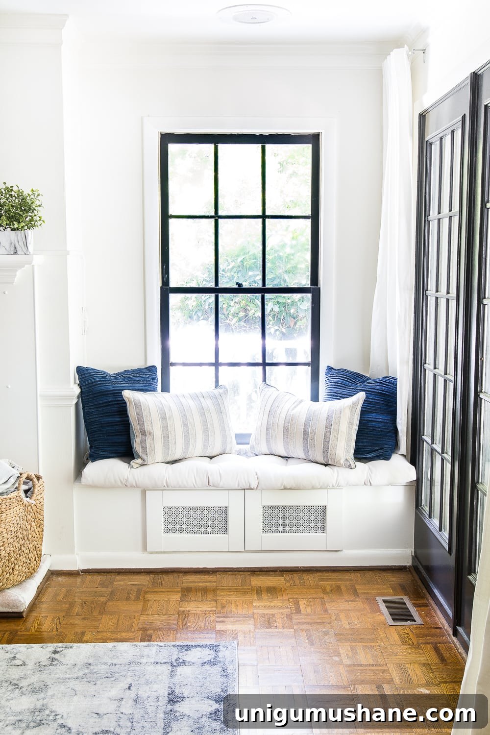 DIY window seat made from a kitchen cabinet to hide TV cable boxes and gaming system